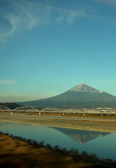 Mount Fuji seen from a moving train